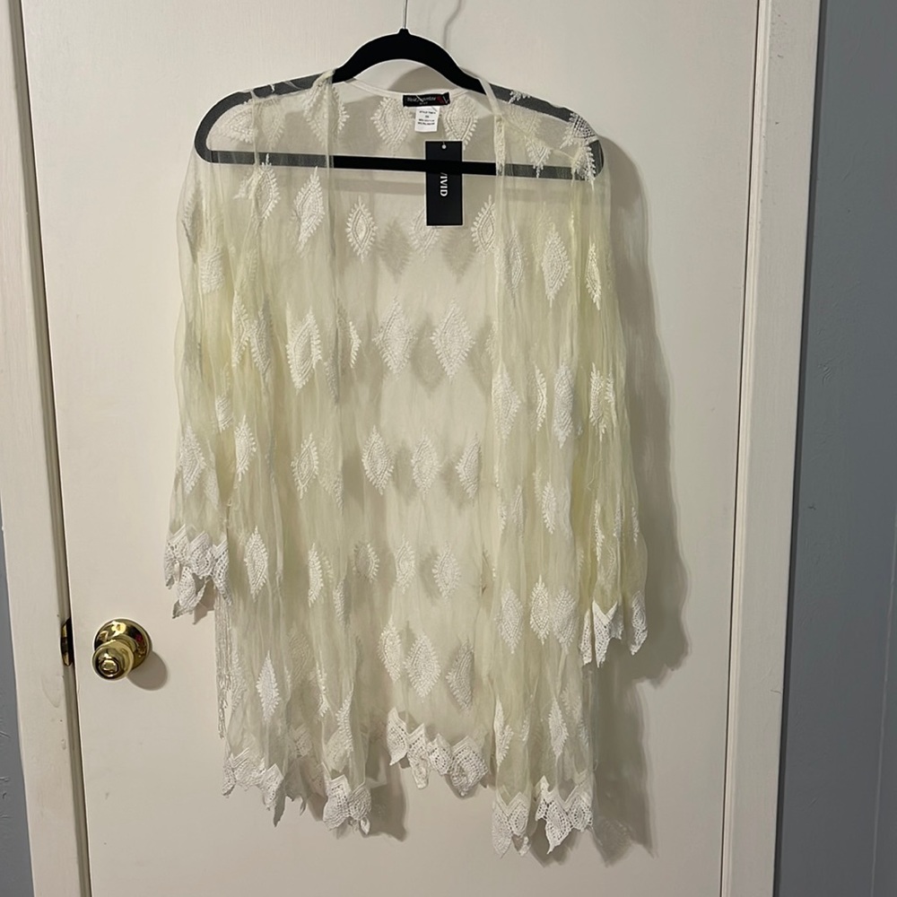 Vivid ivory sheer coverup with super fun fringe arms